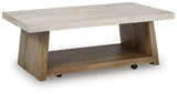 Ashley Furniture Brendalhouse cocktail coffee table with a wooden finish and modern design, shown in a contemporary living room setting.