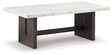 Ashley Furniture Burkhaus coffee table, stylish cocktail table with a modern design, featuring a wooden top and metal legs.
