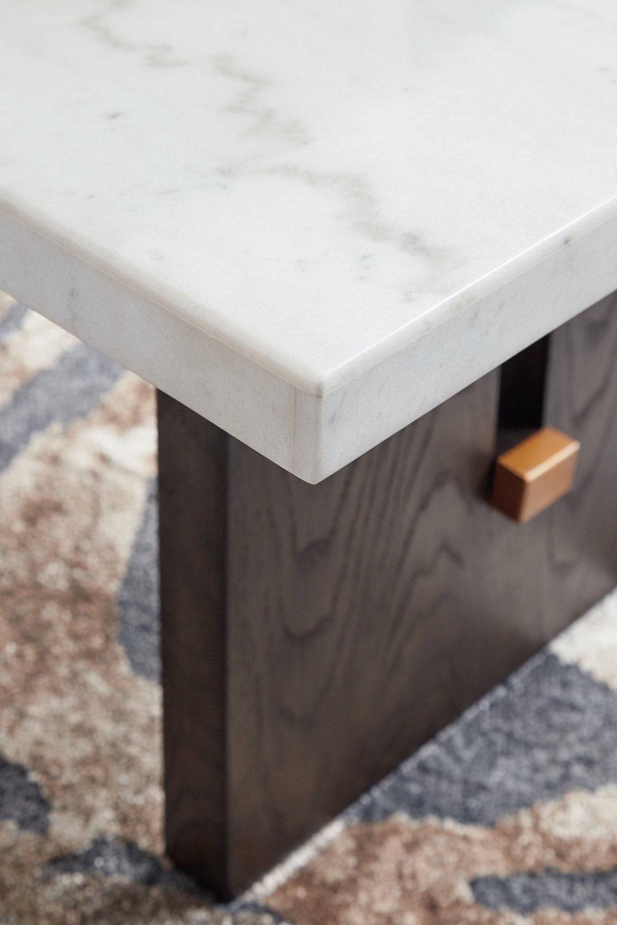 Ashley Furniture Burkhaus coffee cocktail table with a sleek wooden surface and modern design.
