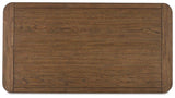Cabalynn cocktail coffee table by Ashley Furniture with a sleek wooden surface and modern design for living room decor.