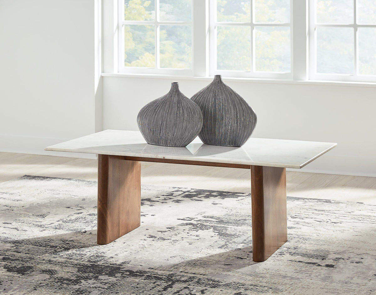 Ashley Furniture Isanti Coffee Table, a stylish cocktail table with a modern design, featuring a wooden finish and sturdy legs.