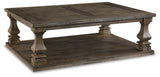 Ashley Furniture Johnelle coffee cocktail table with a sleek wooden surface and modern design, ideal for living room decor.
