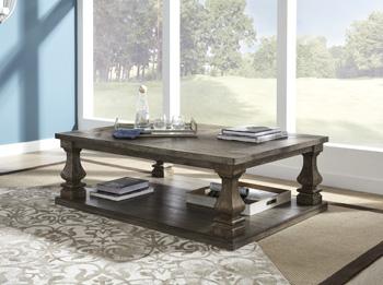 Ashley Johnelle coffee cocktail table with wood finish and modern design, featuring a spacious tabletop and sturdy legs.