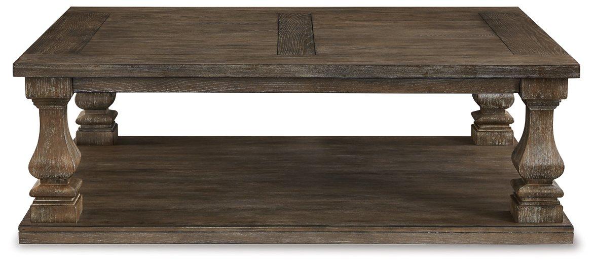 Ashley Johnelle coffee table, modern cocktail table with wood finish and sleek design, ideal for living room decor.