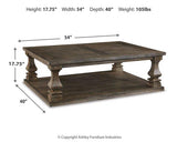 Ashley Johnelle coffee table, a stylish cocktail table with a wooden finish, perfect for living room decor.