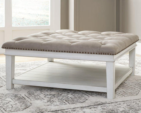 Ashley Furniture Kanwyn upholstered cocktail ottoman coffee table with fabric upholstery and wooden legs, stylish and functional.