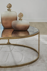 Close-up of the Ashley Furniture Korajane coffee table showing its detailed wooden surface and elegant cocktail table design.