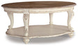 Ashley Furniture Realyn coffee table, modern cocktail table with wood finish and sleek design, perfect for living room decor.