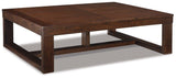 Ashley Watson cocktail coffee table with a wooden finish, modern design, and sturdy legs, ideal for living room decor.