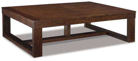Ashley Watson cocktail coffee table with a wooden finish, modern design, and sturdy legs, ideal for living room decor.