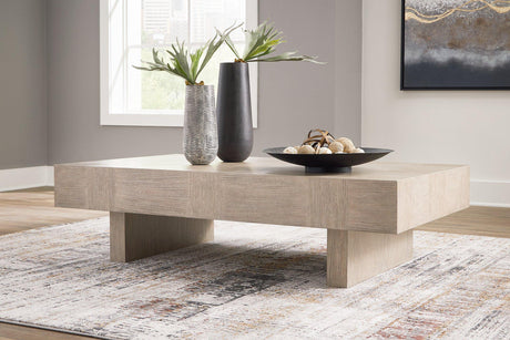 Ashley Jorlaina coffee cocktail table with a sleek wooden finish and modern design, perfect for living room decor.