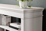 Ashley Furniture Kanwyn Credenza curio cabinet with glass doors and wooden shelves for elegant display storage.