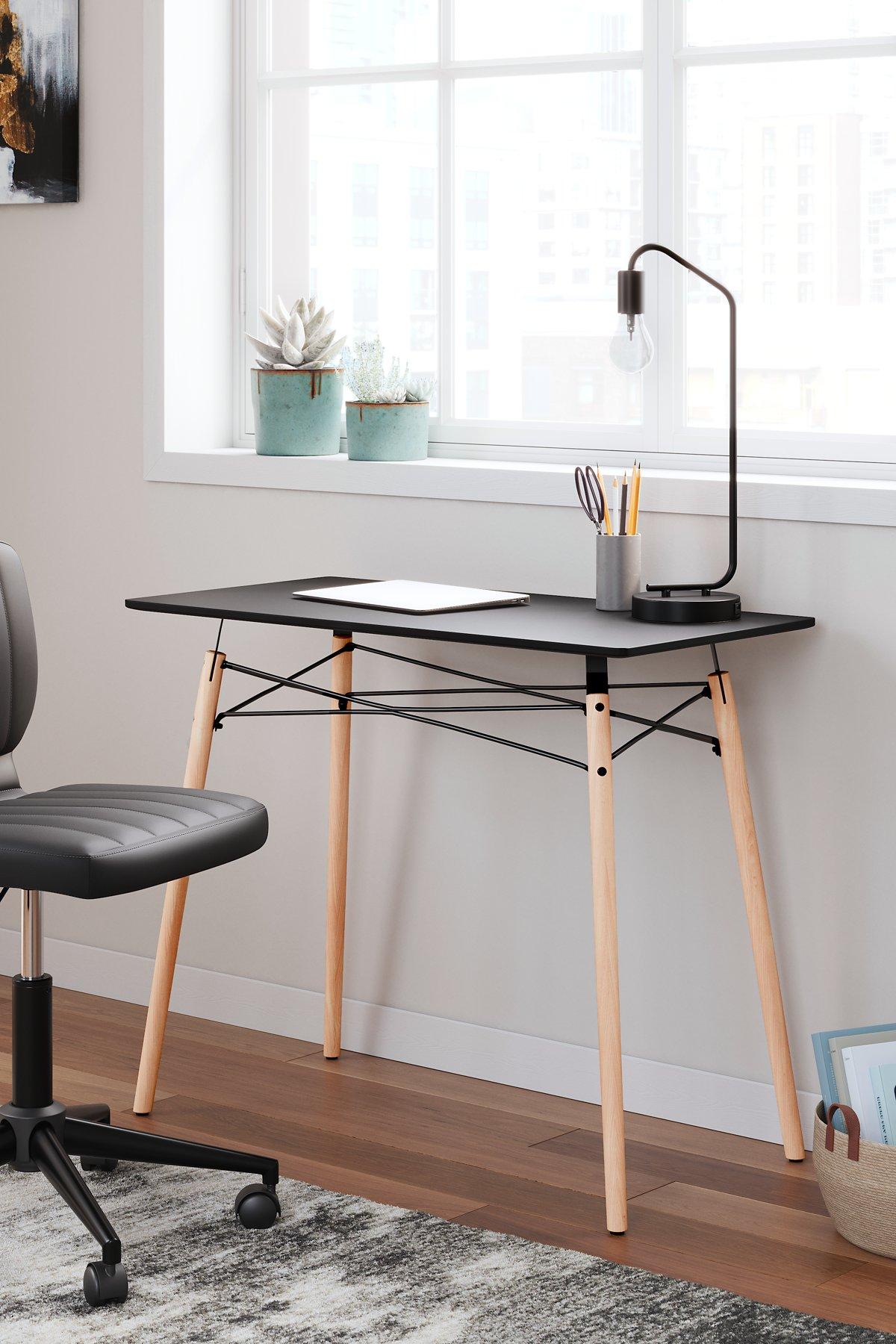 Ashley Furniture Jaspeni home office desk with a spacious surface and modern design, ideal for study or work spaces.