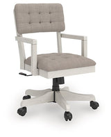 Ashley Furniture Robbinsdale home office desk chair with padded armrests and a swivel base, shown from an angled side view.