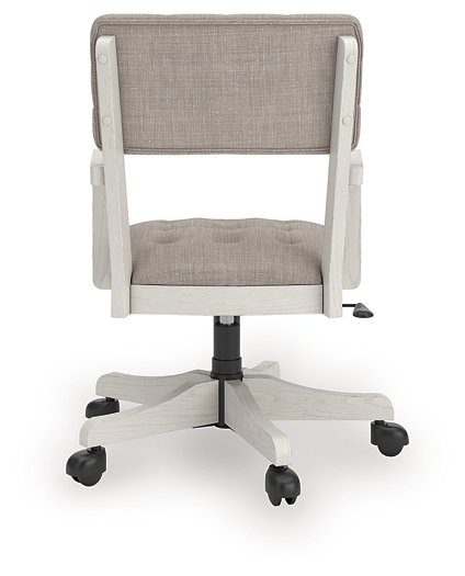 Ashley Furniture Robbinsdale home office desk chair with padded backrest and armrests, shown from the back.