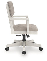 Ashley Furniture Robbinsdale home office desk chair with padded armrests and a cushioned seat, shown from the side.