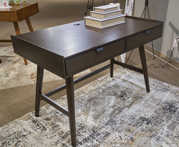 Ashley Furniture Dantenton 46-inch home office desk with a sleek wooden surface and sturdy metal legs.
