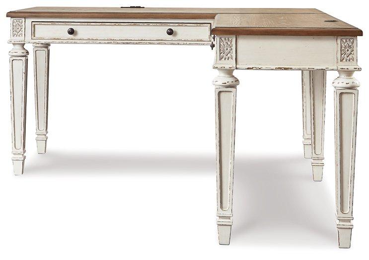 Realyn 2-piece home office desk by Ashley Furniture, featuring a modern design with a spacious work surface and sleek finish.
