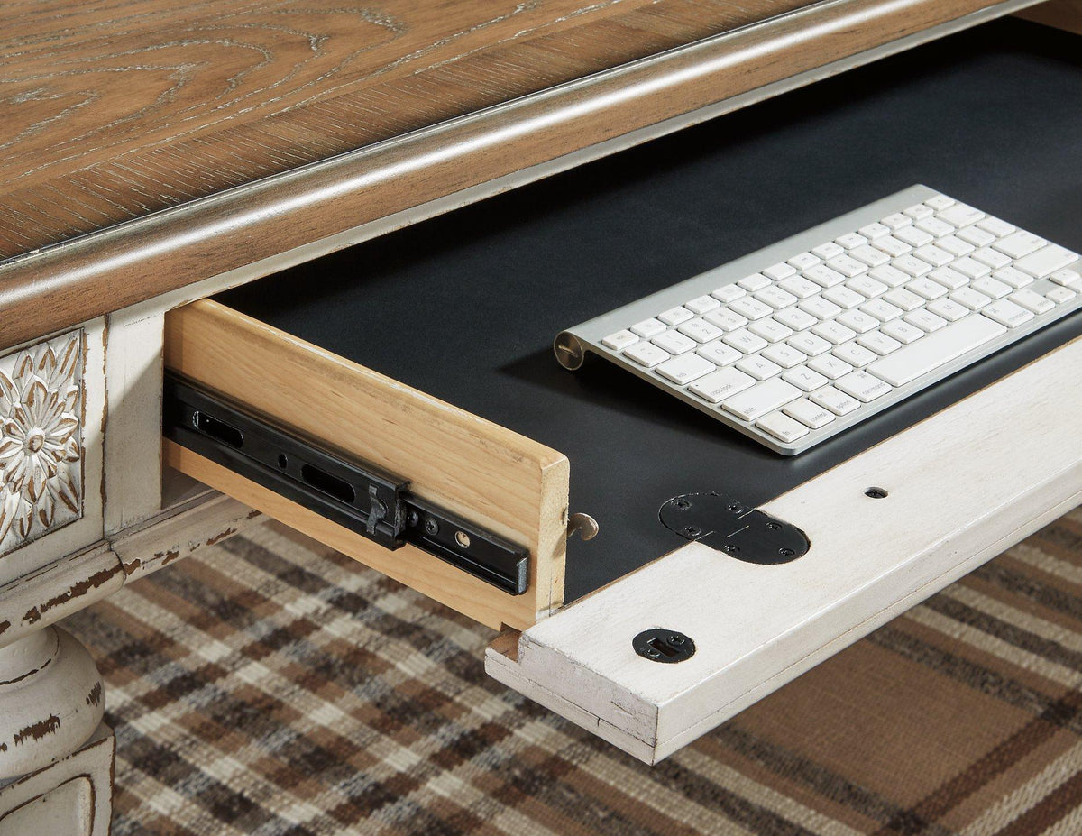 Realyn 2-piece home office desk set by Ashley Furniture featuring a sleek, modern design with spacious work surfaces and storage.