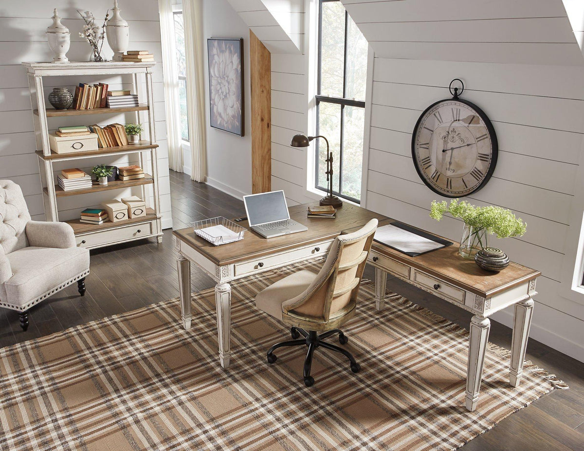 Realyn 2-piece home office desk by Ashley Furniture, featuring a modern design with a spacious workspace and sleek wood finish.