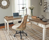 Realyn 2-piece home office lift top desk by Ashley Furniture showing the sleek wooden surface and lift mechanism.