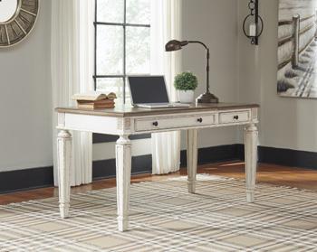 Realyn Home Office Lift Top Desk by Ashley Furniture showing a modern wooden desk with a lift-up work surface and storage compartments.