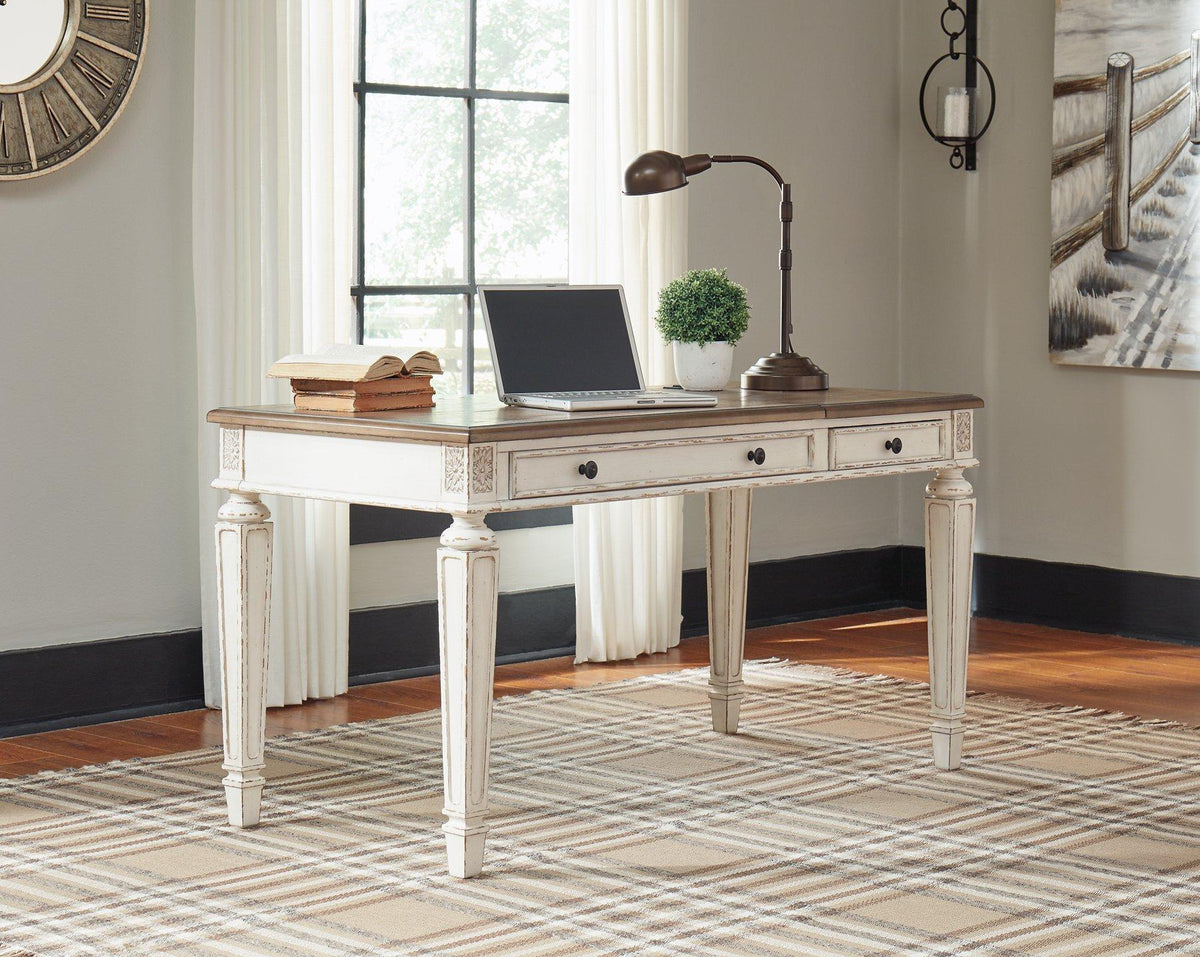 Ashley Furniture Realyn Home Office Lift Top Desk showing a sleek wooden desk with a lift-up top and storage compartments.