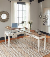 Ashley Furniture Realyn Home Office Lift Top Desk with wood finish and spacious workspace, ideal for home office setups.