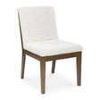 Ashley Furniture Marxmore dining chair with upholstered seat and wooden legs, shown from an angled side view.