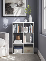 Ashley Furniture Onita Six Cube Organizer with open storage cubes in a modern wood finish.