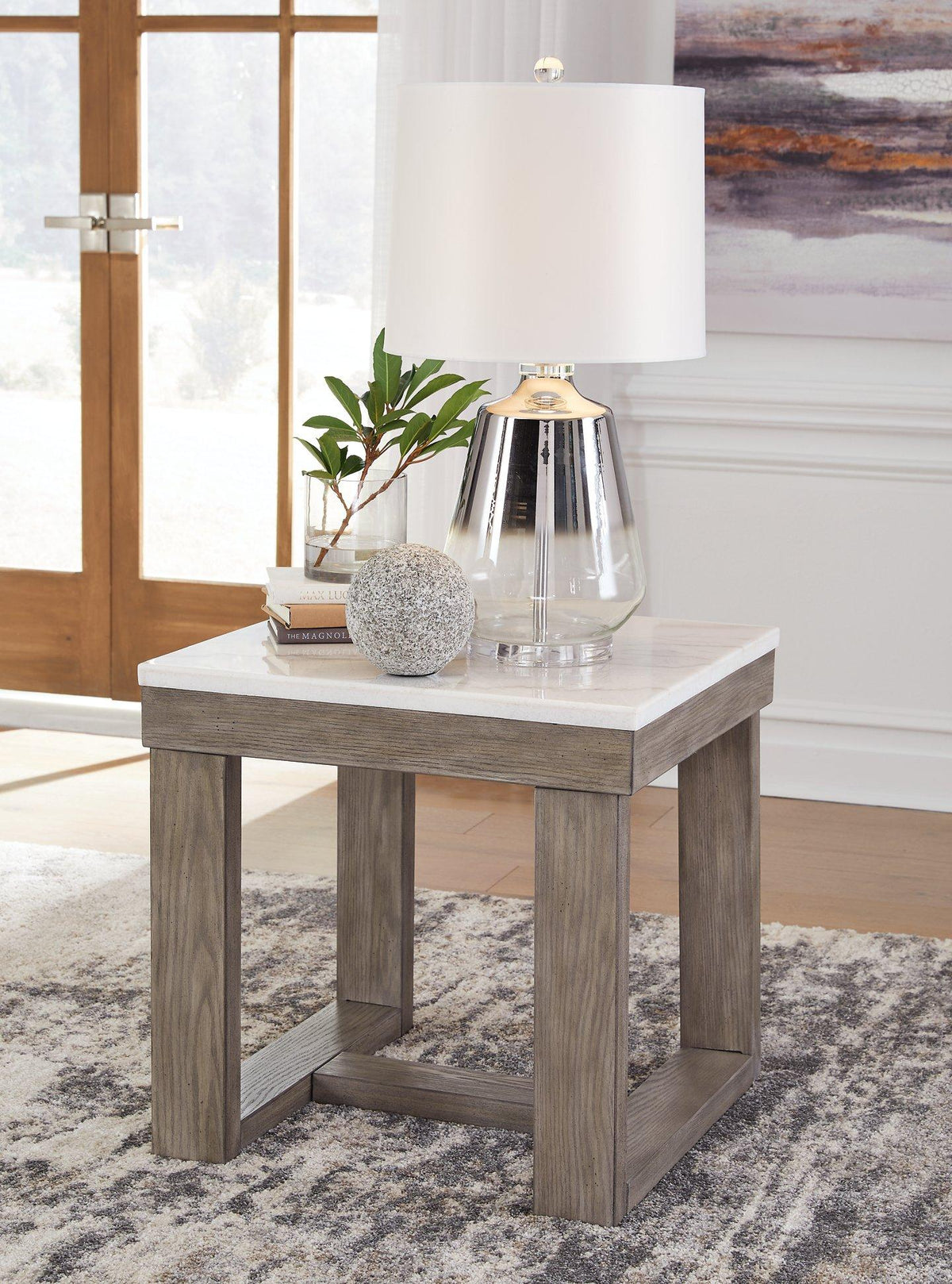 Ashley Furniture Loyaska End Table with wooden surface and modern design, perfect for living room or bedroom decor.