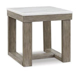 Ashley Furniture Loyaska End Table showing a sleek wooden surface with a modern design, ideal for living room decor.