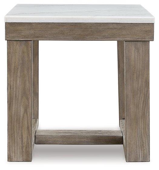 Ashley Furniture Loyaska End Table featuring a modern design with a wooden finish and sleek metal legs.
