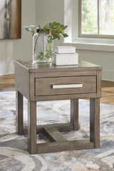 Ashley Furniture Loyaska end table with a wooden top and modern design, featuring a sleek base and stylish finish.