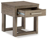 Ashley Furniture Loyaska End Table with wooden top and sleek metal legs, ideal for living room or bedroom decor.