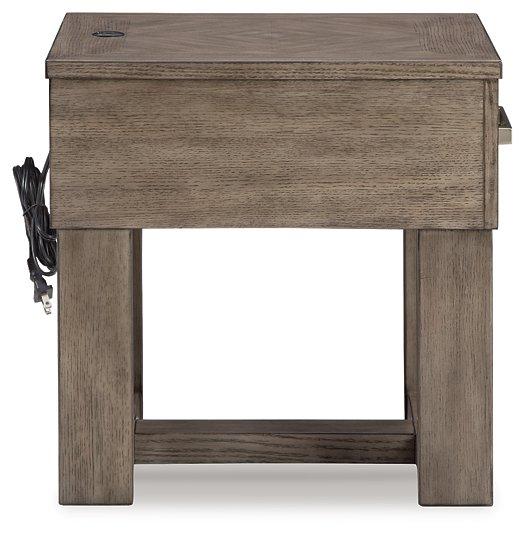 Ashley Furniture Loyaska End Table with wooden top and black metal legs, modern design for living room décor.