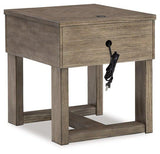 Ashley Furniture Loyaska End Table with wooden surface and sleek design, perfect for living room decor.