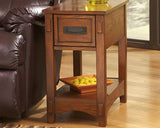 Ashley Furniture Breegin chairside end table with wood finish, compact design, and storage shelf for living room use.