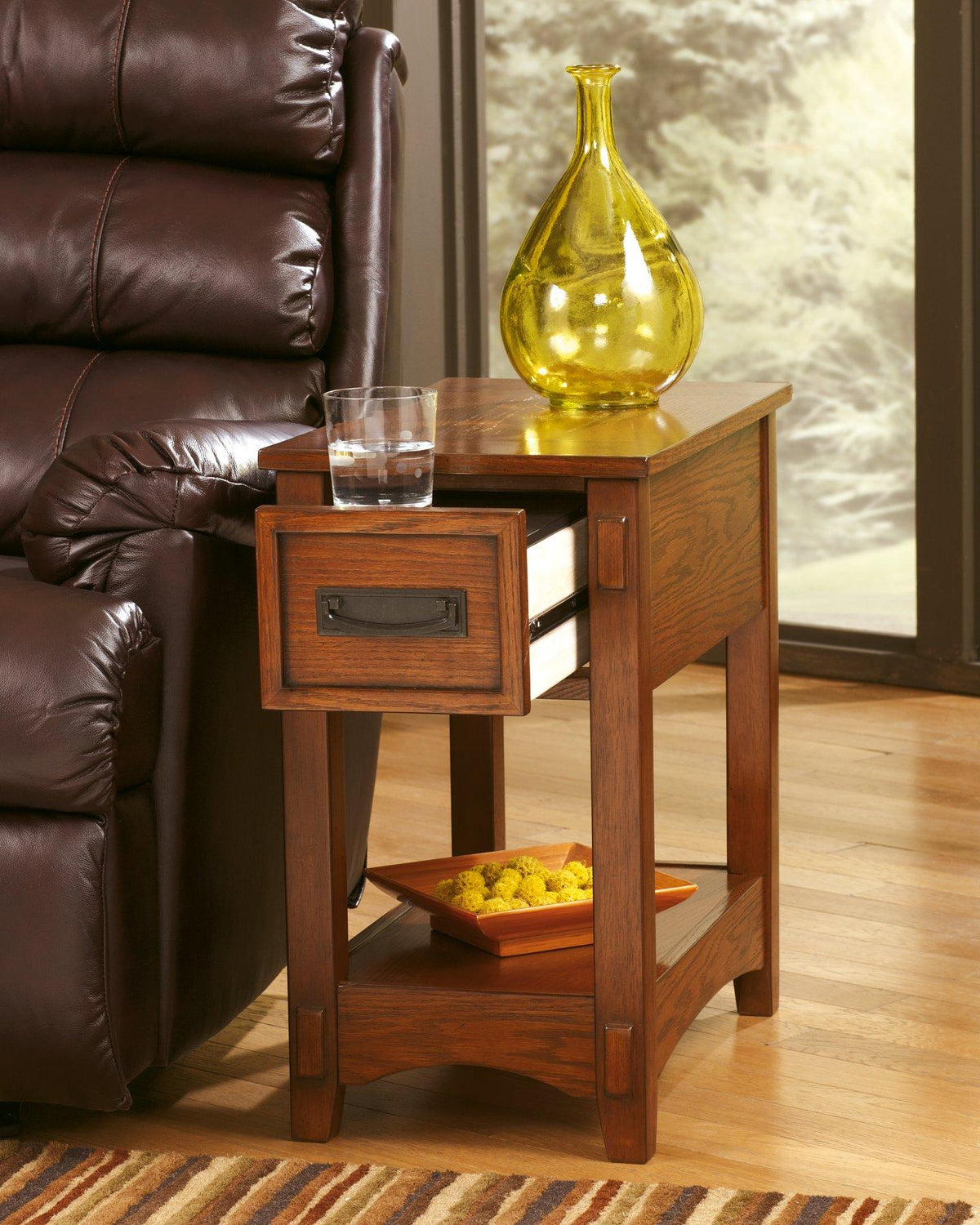 Ashley Furniture Breegin chairside end table with wood finish, featuring a compact design and functional surface for living room use.