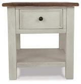 Ashley Furniture Bolanburg end table with a wood finish, featuring a sleek top and sturdy legs, designed for living room decor.