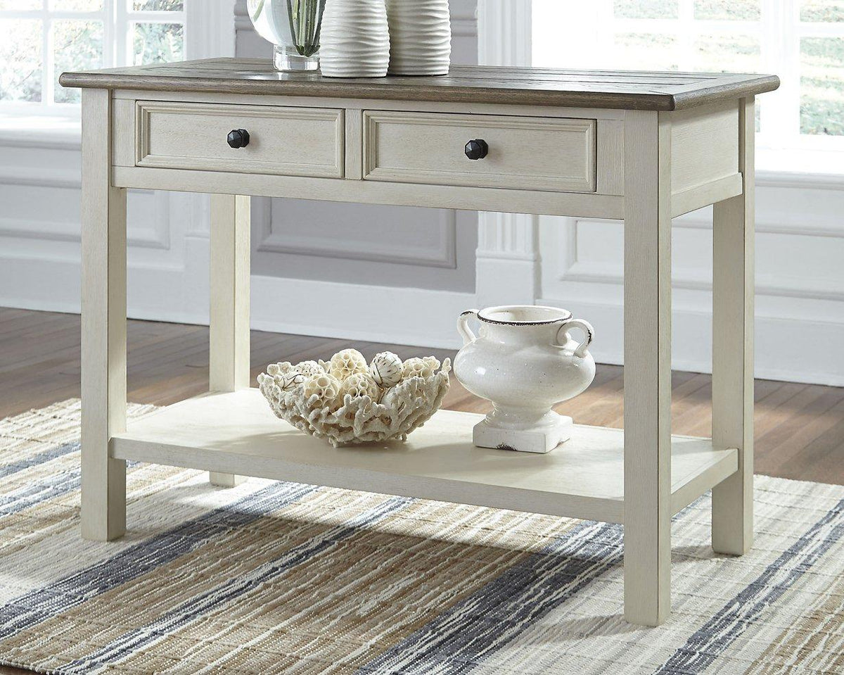 Ashley Furniture Bolanburg end table, console style with wood finish, featuring a sleek tabletop and storage shelf.