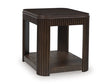 Ashley Furniture Carlibrie end table with a sleek, modern design featuring a smooth surface and sturdy wooden legs.