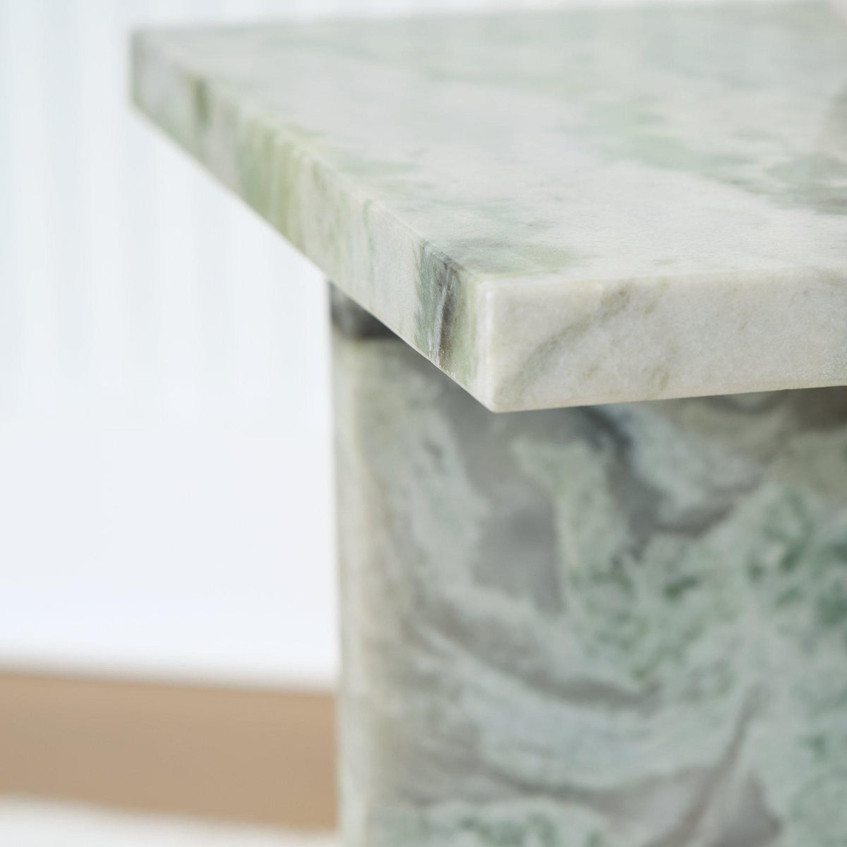 Deaconwell accent end table by Ashley Furniture featuring a wooden surface and sleek metal legs.