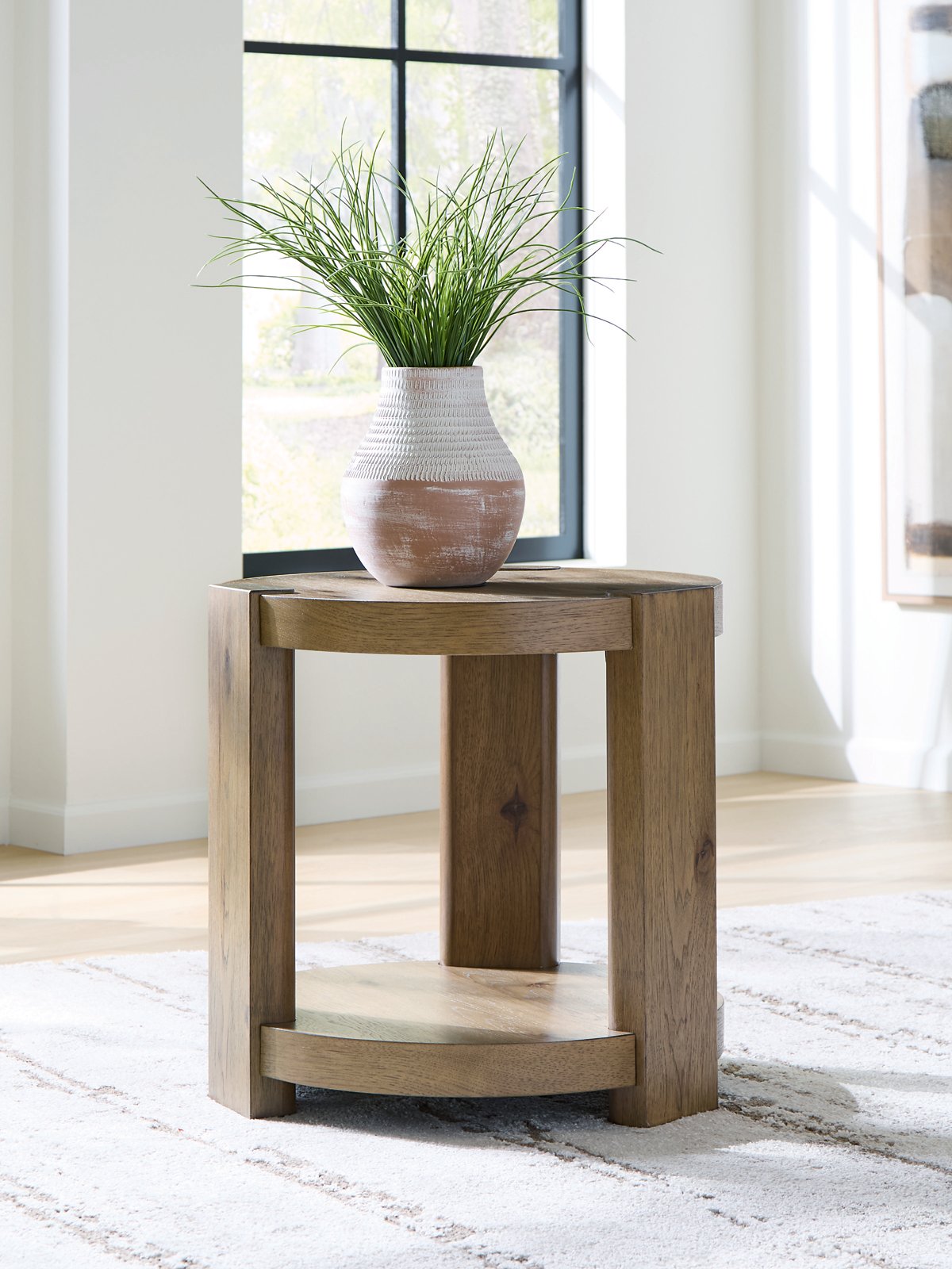 Ashley Furniture Flangren End Table with a wooden surface and modern design, featuring a sturdy base and clean lines.
