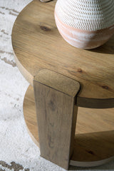 Ashley Furniture Flangren end table with a wooden top and metal legs, modern design, shown in a cozy living room setting.