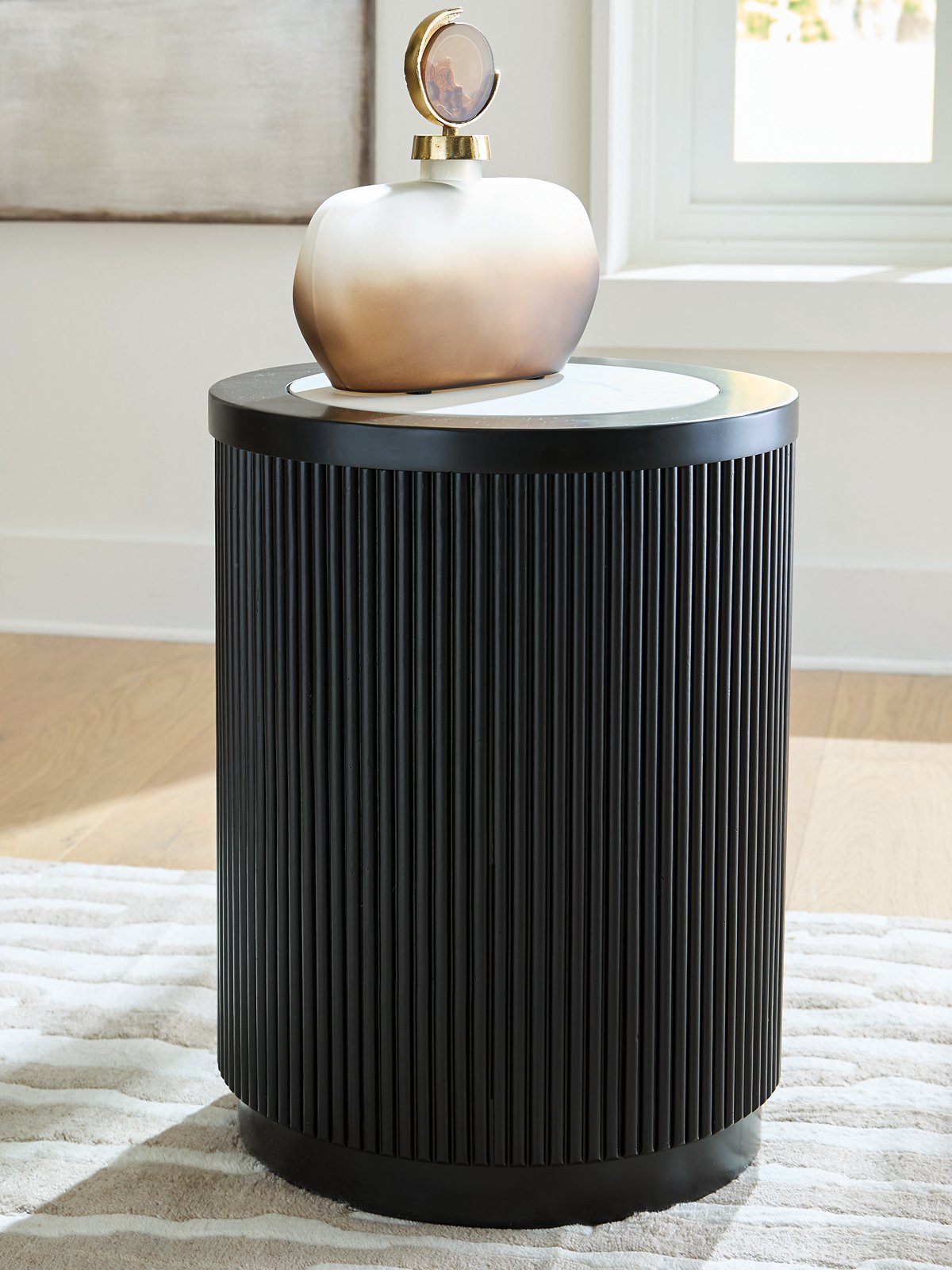 Grayman end table by Ashley Furniture with a modern design, featuring a sleek gray finish and sturdy wooden construction.