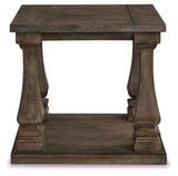 Ashley Furniture Johnelle end table with a wooden top and tapered legs, shown from a head-on angle.