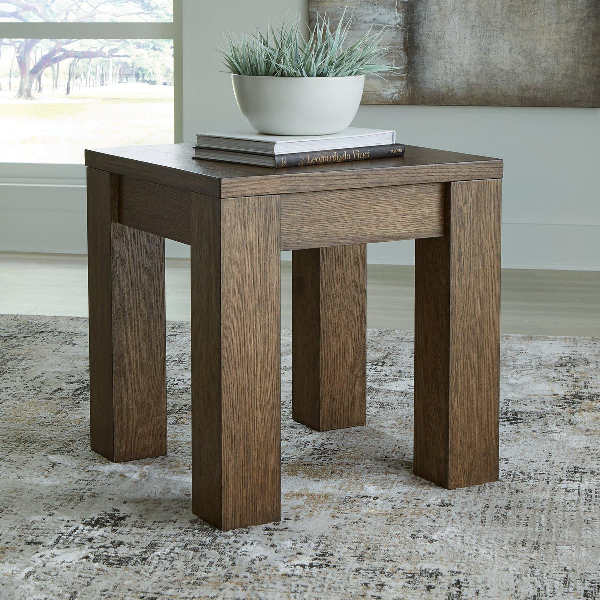 Ashley Furniture Rosswain end table showing a wooden surface with a modern design and sturdy legs.