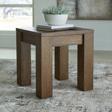 Ashley Furniture Rosswain end table showing a wooden surface with a modern design and sturdy legs.