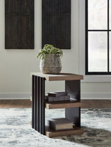 Ashley Furniture Rylandyn end table with a sleek wooden top and modern design, shown in a close-up shot.